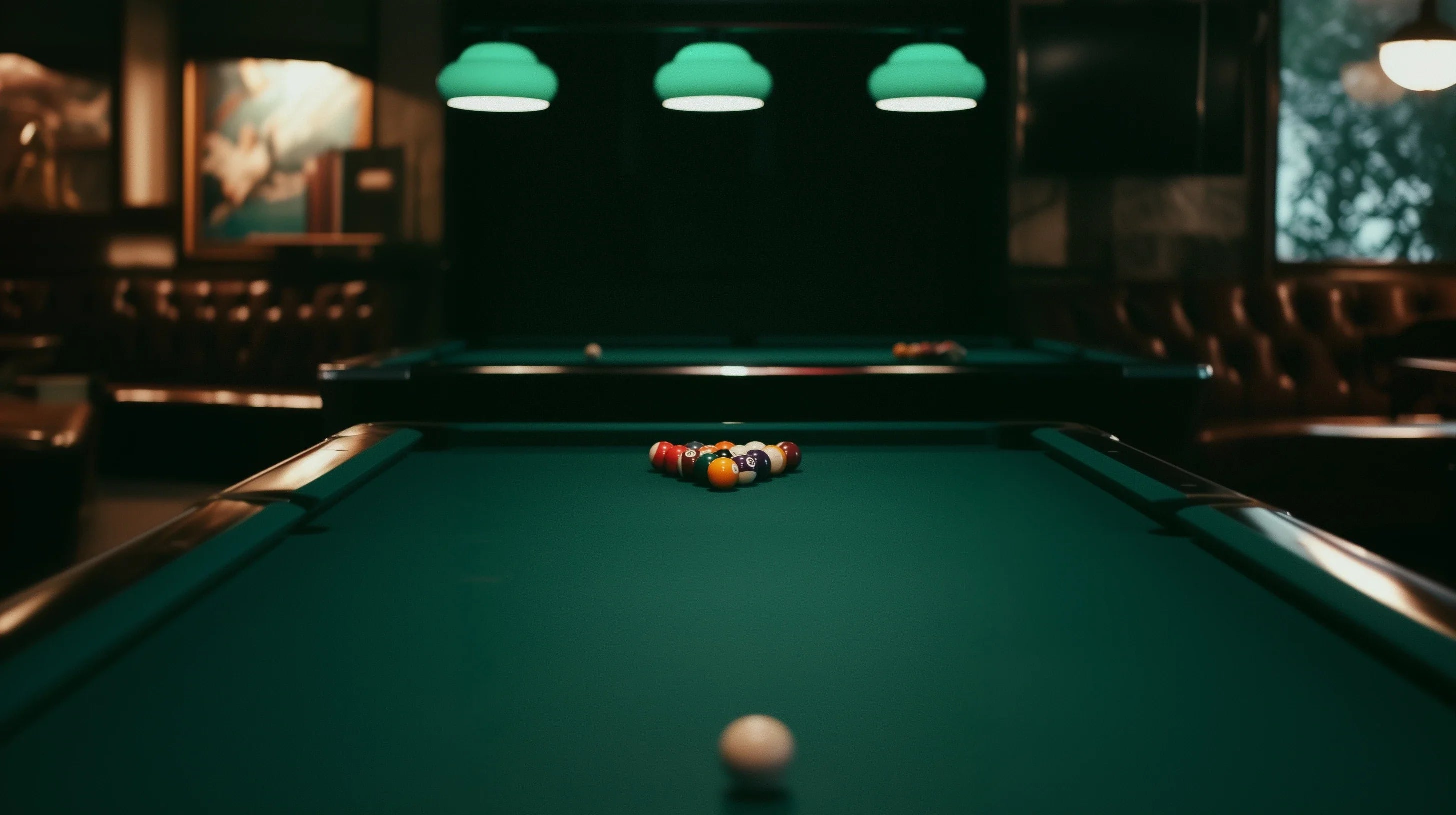 A pool table with a rack of balls on it