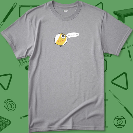 A T-Shirt titled "Missed Me Cartoon Nine Ball T-Shirt - Playful Pool Design | 7 Colors" from Crossbank Clothing