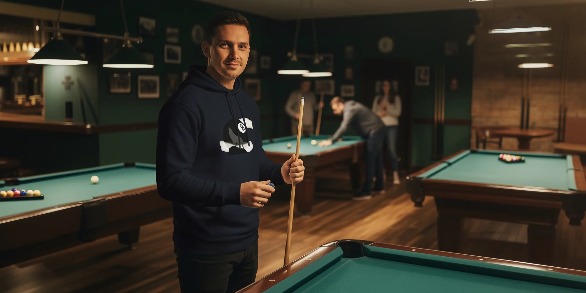 Man wearing a navy blue Eight Ball Wolf hoodie from Crossbank Clothing