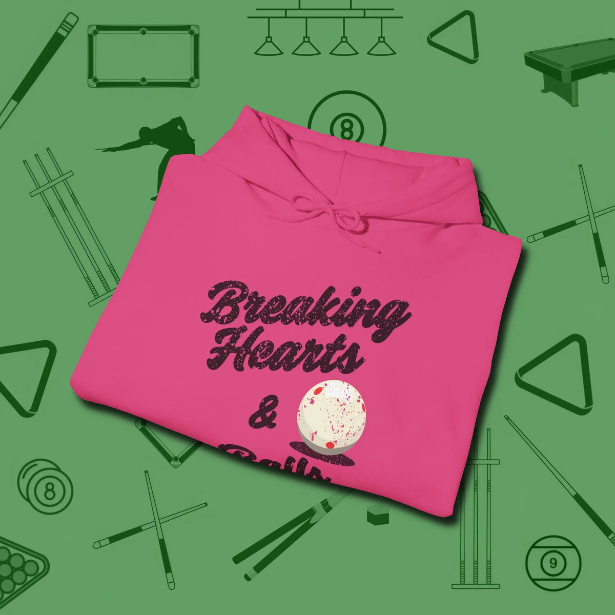 Breaking Hearts and Balls Hoodie, folded view, in Heliconia classic cue style, no gimmicks