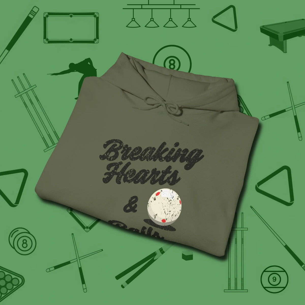 Breaking Hearts and Balls Hoodie, folded view, in Military Green fashion with break-and-run energy