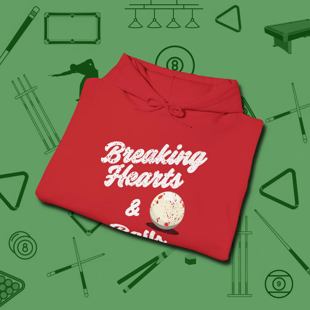 Breaking Hearts and Balls Hoodie, folded view, in Red for players who live the game