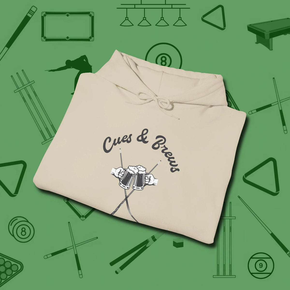 Cues & Brews Hoodie, folded view, in Sand helps your stroke and your style