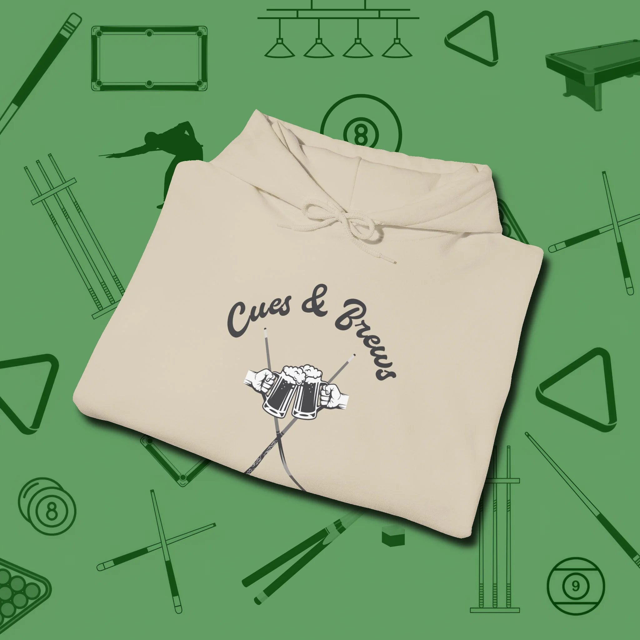 Cues & Brews Hoodie, folded view, in Sand helps your stroke and your style