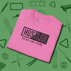 Hustler Grind and Shine T-Shirt, folded view, in Azalea fashion with break-and-run energy
