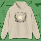 I Beat People With Sticks Hoodie, front view, in Sand dress for the shot you want to take