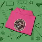 Midnight Grinder Badge Hoodie, folded view, in Heliconia cool under pressure, hot on the eyes