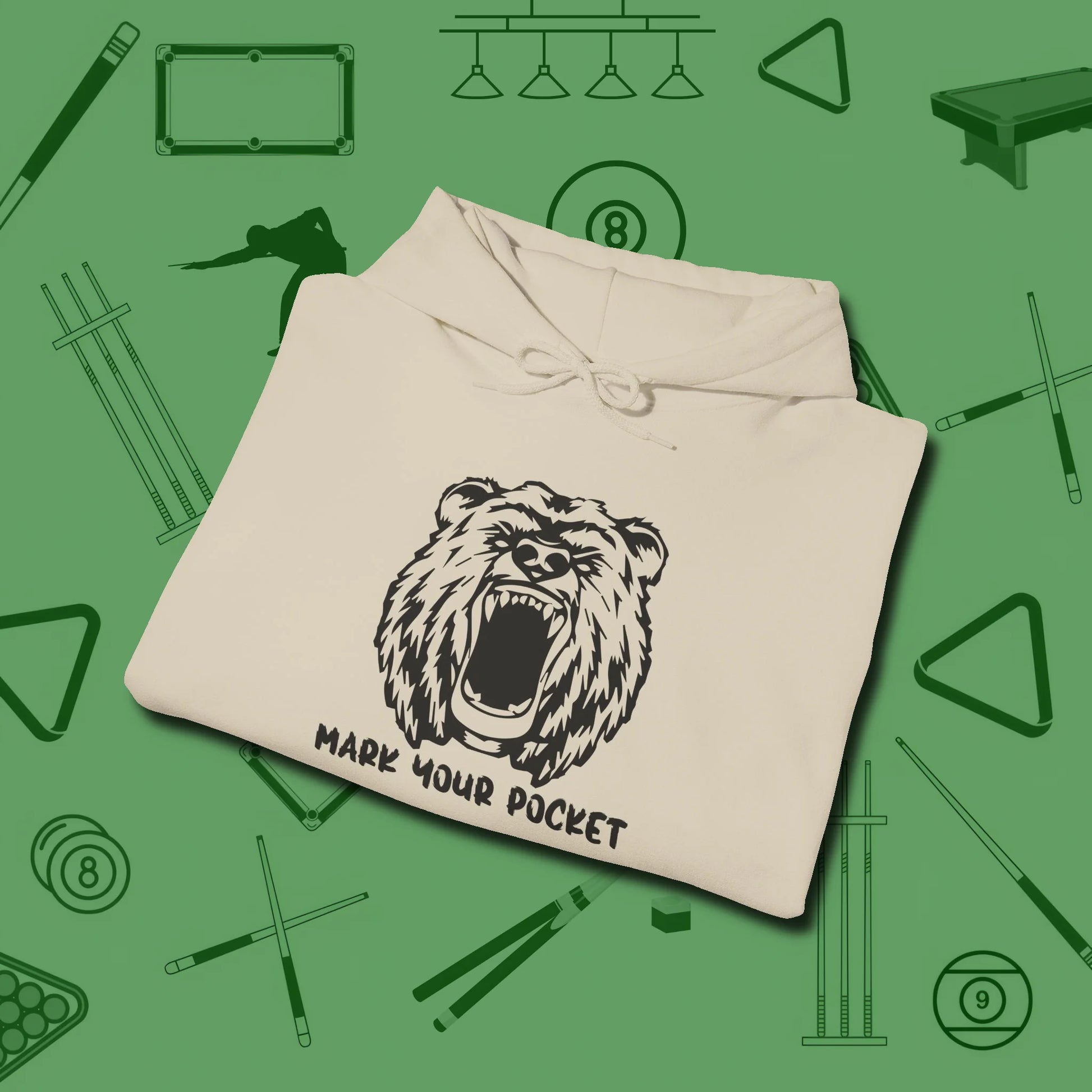 Roaring Grizzly Mark Your Pocket Hoodie, folded view, in Sand made for pool sharks, not posers