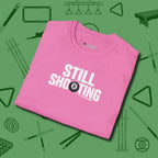Still Shooting T-Shirt, folded view, in Azalea your secret weapon off the table