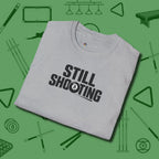 Still Shooting T-Shirt, folded view, in Sport Grey designed for dead stroke and deadpan looks
